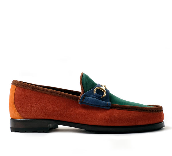 Multicolored loafer with a gold buckle on a white background